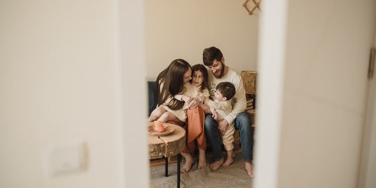 A loving family enjoying a warm, intimate moment together indoors.